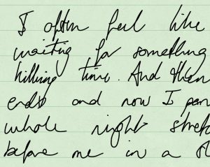 A square of green lined paper full of black almost illegible cursive text in English.