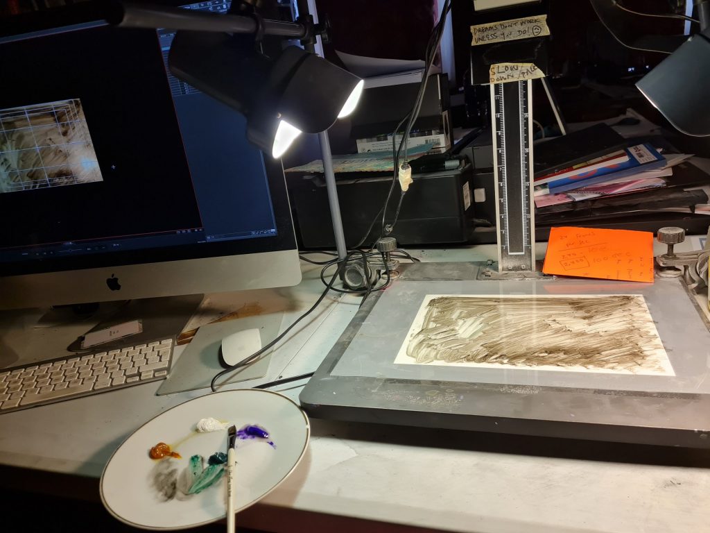 Shot of Latifah's working desk, computer and paint