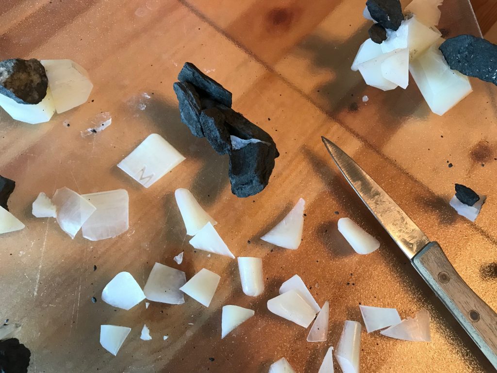 Rocks, soaps and knife on studio table