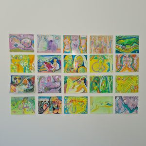 Photograph of 20 works on paper on the wall