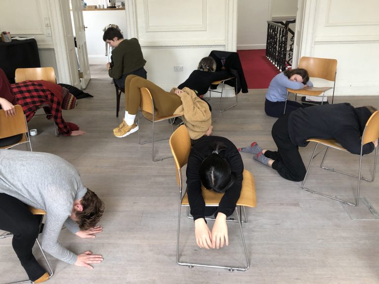 Nine different women resting their bodies in different forms on a brown chair